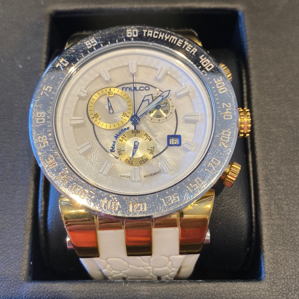 Mulco Unisex watch.  White band. Gold and silver bessel and trim